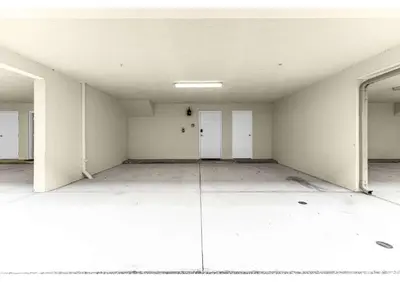 an empty room with white walls and white doors at Summer Fun Starts Here - Townhome by Disney! in Orlando