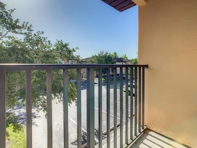 a balcony with a railing next to a building at Old Town and Food trucks around the corner in Orlando