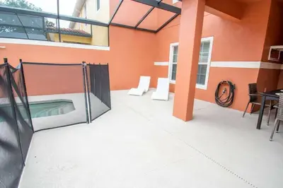 a balcony with a pool in a building at Great deal townhome on Paradise Palms in Kissimmee