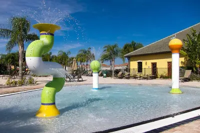 a water park with a sprinkler in a pool at Great deal townhome on Paradise Palms in Kissimmee