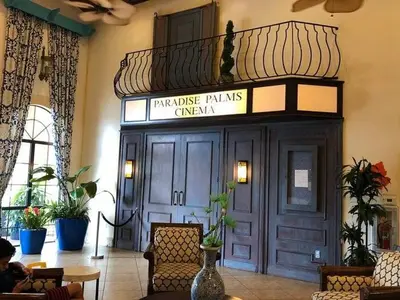 a hotel lobby with a sign that reads private palms cinema at Great deal townhome on Paradise Palms in Kissimmee