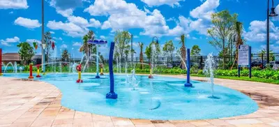 a water park with fountains in a park at Gatsby Escape: Private Pool Near Disney & Resorts in Kissimmee