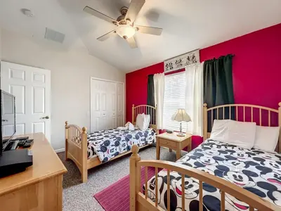 a bedroom with two beds and a ceiling fan at Krista's Tropical Escape: Resort Stay Near Disney in Kissimmee