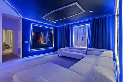 a living room with blue walls and a couch at Paradiso Grande Resort 9Bedroom Vacation Home 6210 in Orlando