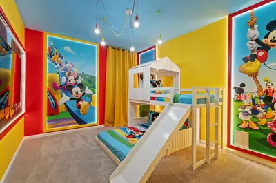 a childs room with colorful walls and a slide at Paradiso Grande Resort 9Bedroom Vacation Home 6210 in Orlando