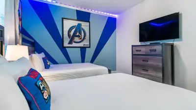 a hotel room with two beds and a flat screen tv at CTD4751-401 in Kissimmee
