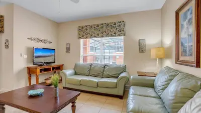 a living room with a couch and a table at CUP8968 in Kissimmee