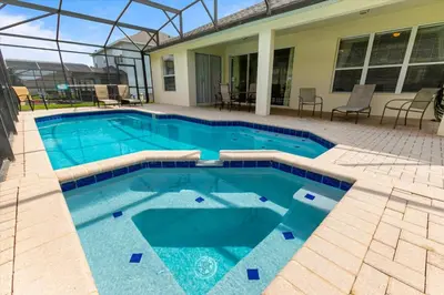 a swimming pool with blue water in a house at MNL2678 in Orlando