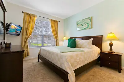 a bedroom with a bed and a window at MNL2678 in Orlando