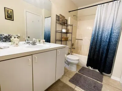 a bathroom with a sink and a toilet and a shower at 2950 COTTAGE GROVE COURT ORLANDO 3BED in Orlando