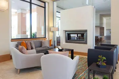 a living room with a couch and a fireplace at Luxury Townhome Near Disney w/ Resort Amenities in Orlando