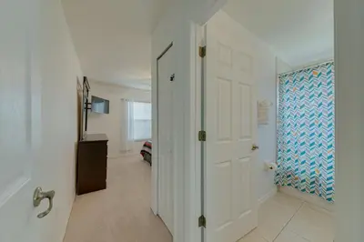 a hallway with a door leading to a room at 5 Bedroom private pool home in Veranda Palms in Kissimmee
