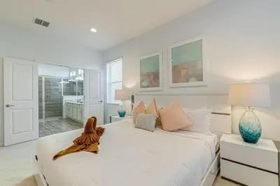 a bedroom with a large bed with a fish on it at 6 Bed villa close to disney in Kissimmee