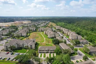 an aerial view of a residential neighborhood with houses at Mickey's Play House: Family Fun & Comfort in Kissimmee
