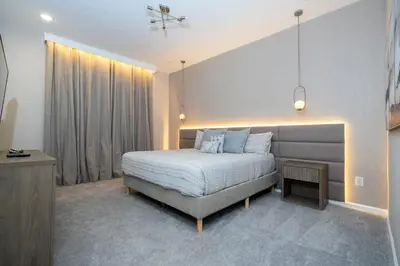 a bedroom with a bed and a large window at 5761 HS - Spacious Luxury Villa in Paradiso Grande in Orlando