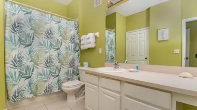 a bathroom with a toilet and a sink and a shower at ALM2774-204 in Orlando