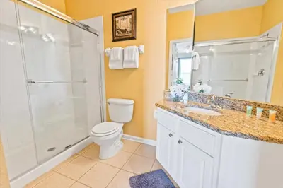 a bathroom with a shower and a toilet and a sink at ALM2813-403 in Orlando