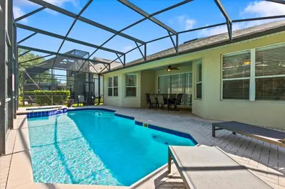 a swimming pool with a glass roof on a house at DVL2638 in Orlando