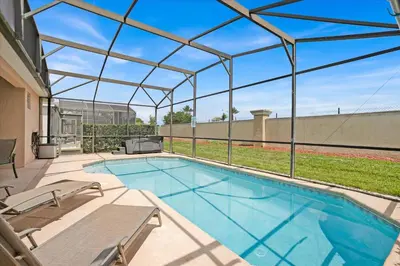 an indoor swimming pool with a glass roof at FP8190 Windsor Palms Resort Vacation Home in Kissimmee