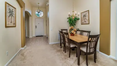 a dining room with a table and chairs at FP8147 Windsor Palms Resort Vacation Home in Kissimmee