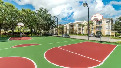 a basketball court with a basketball hoop on a street at FP8159 Windsor Palms Resort Vacation Home in Kissimmee