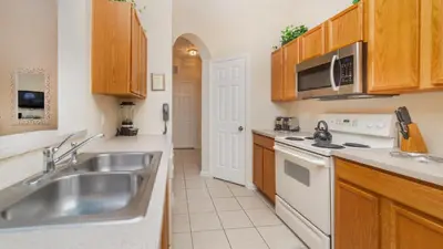 a kitchen with a sink and a stove at CW7650-204 Windsor Hills Resort Vacation Condo in Orlando