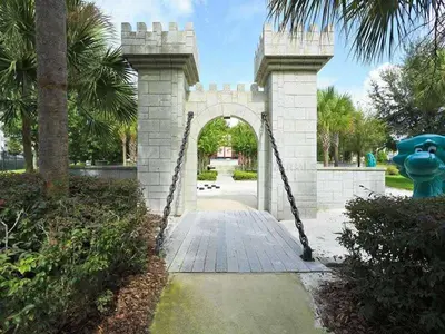 an archway in a park with a statue at Luxury 3-bdr house with pool next to Disney in Orlando
