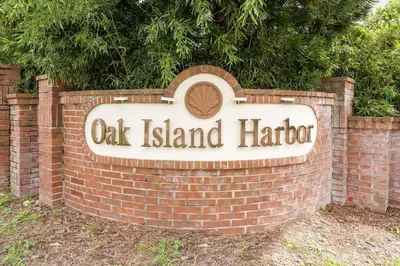 a sign for oak island harbor in a brick wall at New Listing Pool and Game Room 4BR in Orlando