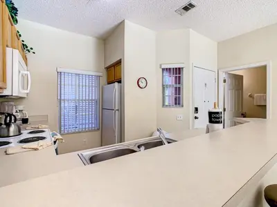a kitchen with a counter top in a room at Spacious Emerald Escape - 12 Mins to Disney in Kissimmee