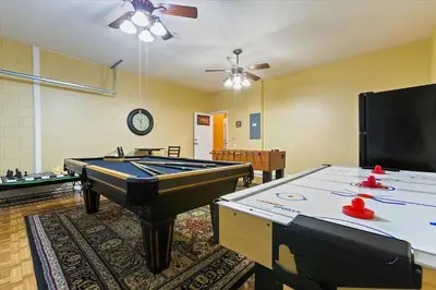 a room with a pool table and ping pong tables at Windsor Hills Resort Vacation Home TS7718 in Orlando