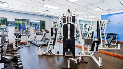 a gym with cardio equipment and tread machines at BCH3031 in Kissimmee