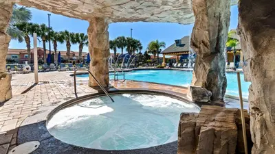 a swimming pool with a hot tub in a resort at BCH3031 in Kissimmee