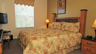 a bedroom with a bed and a window at CW7660-303 Windsor Hills Resort Vacation Condo in Orlando