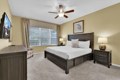 a bedroom with a bed and a ceiling fan at CW7713 Windsor Hills Resort Vacation Home in Orlando