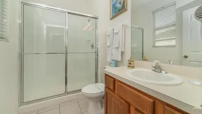a bathroom with a shower and a sink and a toilet at CW7719 Windsor Hills Resort Vacation Home in Orlando