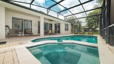 a swimming pool in a house with a glass ceiling at CW7719 Windsor Hills Resort Vacation Home in Orlando