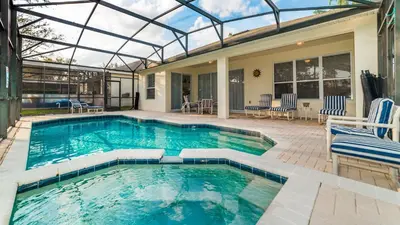 a swimming pool with a glass roof on a house at CW7730 Windsor Hills Resort Vacation Home in Orlando