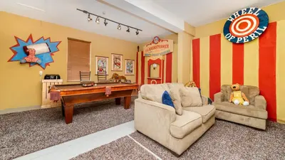 a childs play room with a pool table and two chairs at CW7740 Windsor Hills Resort Vacation Home in Orlando