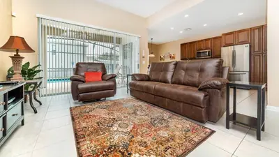a living room with a couch and a chair at CW7740 Windsor Hills Resort Vacation Home in Orlando