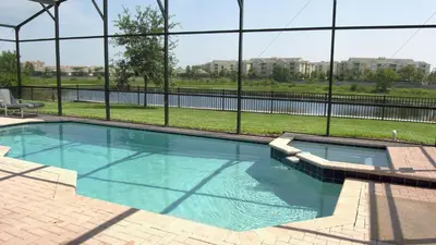a swimming pool in front of a building at DB2605 Windsor Hills Resort Vacation Home in Orlando