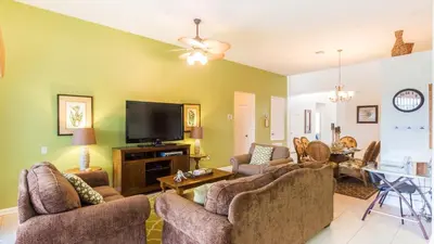 a living room with couches and a flat screen tv at DB2633 Windsor Hills Resort Vacation Home in Orlando