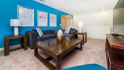 a living room with a couch and a table at BUC2979 in Kissimmee