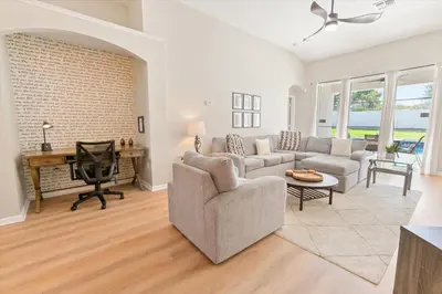 a living room with a couch and a desk at Windsor Palms Resort Vacation Home WP2209 in Kissimmee