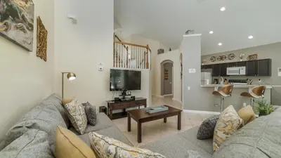 a living room with a couch and a table at KP8038 Windsor Palms Resort Vacation Home in Kissimmee