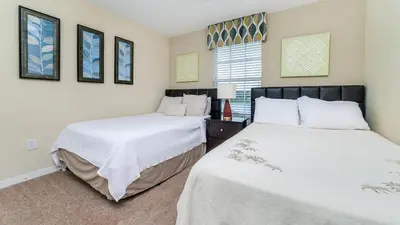 a bedroom with two beds and a window at CAP8875 in Kissimmee