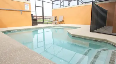 a swimming pool with blue water in a building at CAP8883 in Kissimmee
