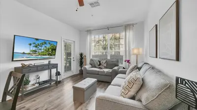 a living room with two couches and a tv at BF 2Bedrooms 2303 - 102 in Kissimmee