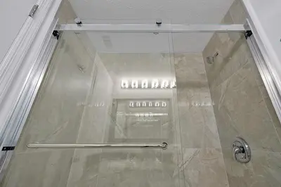 a shower with a glass door in a bathroom at 6165 CARRIER DR #1212 ORLANDO 1BED in Orlando
