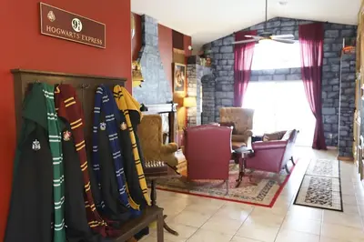 a room with a bunch of baseball bats hanging on a wall at Magical 5-Bedroom Villa Near Universal's Wizarding World in Kissimmee