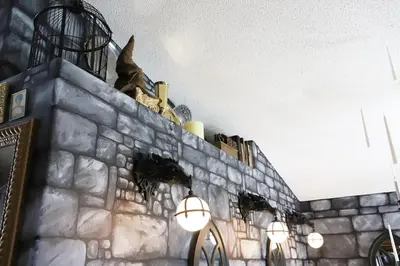 a stone wall with lights on top of it at Magical 5-Bedroom Villa Near Universal's Wizarding World in Kissimmee